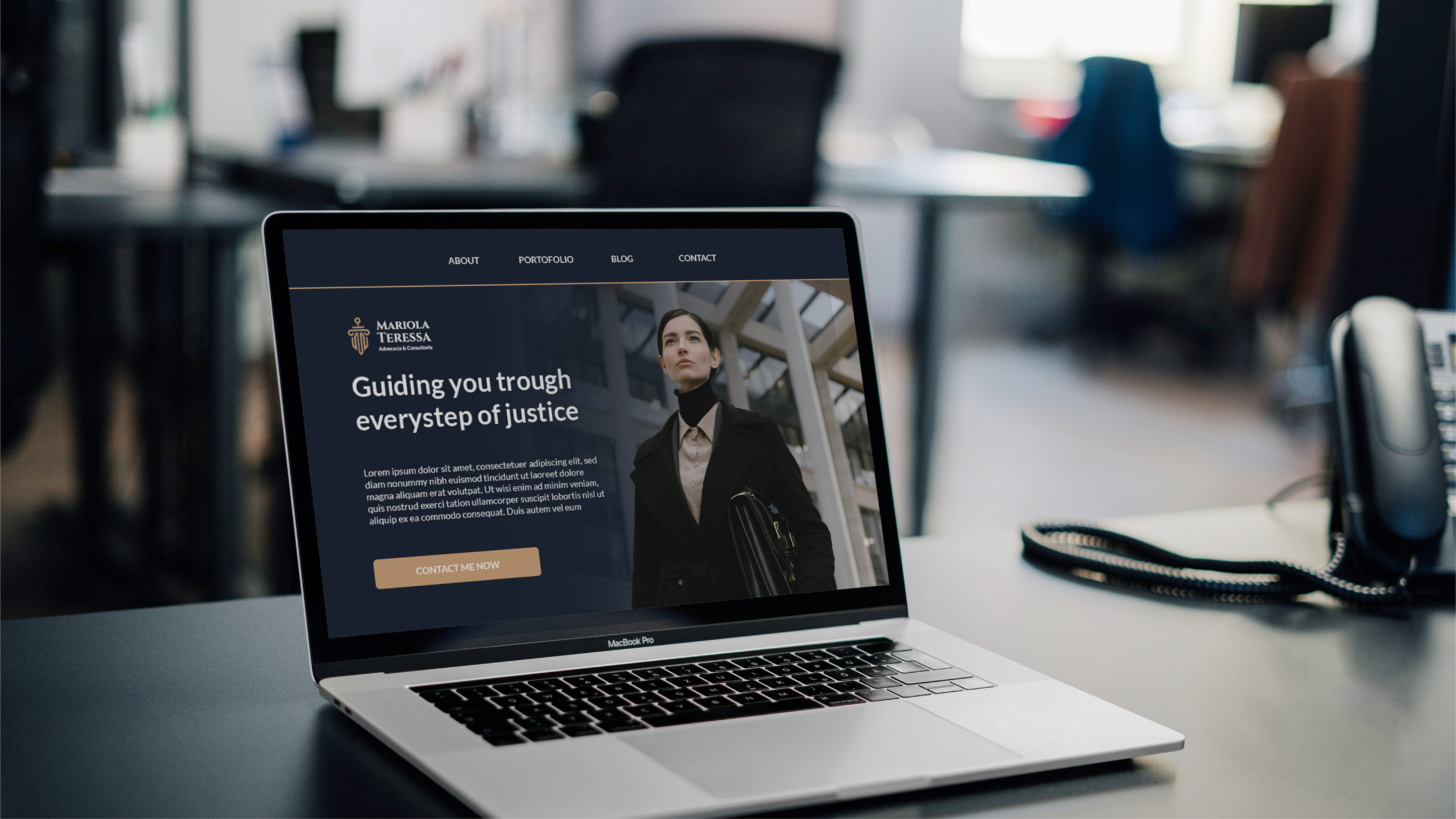 Firm website open on a MacBook in-office