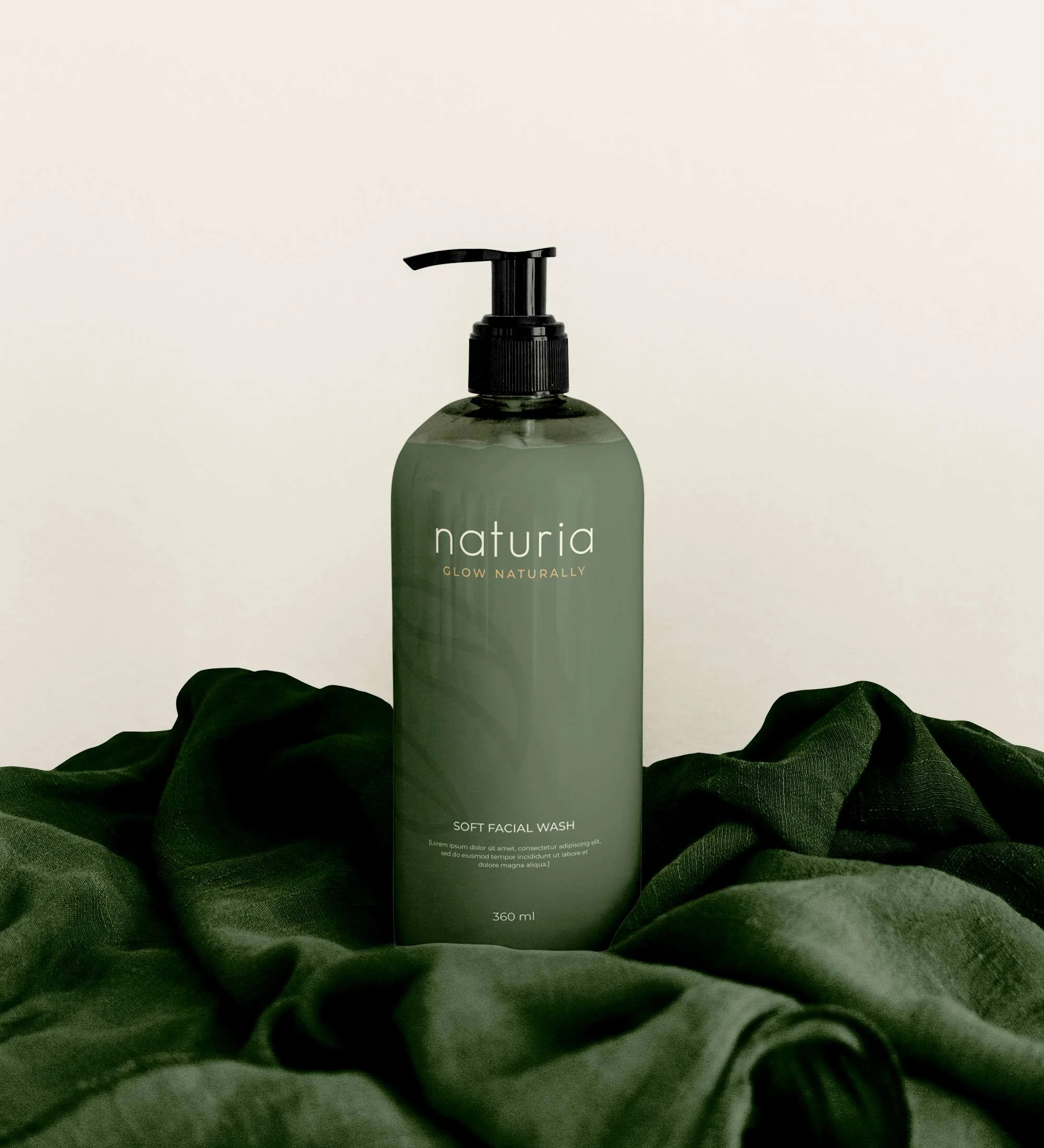 Soft facial wash bottle on draped green linen
